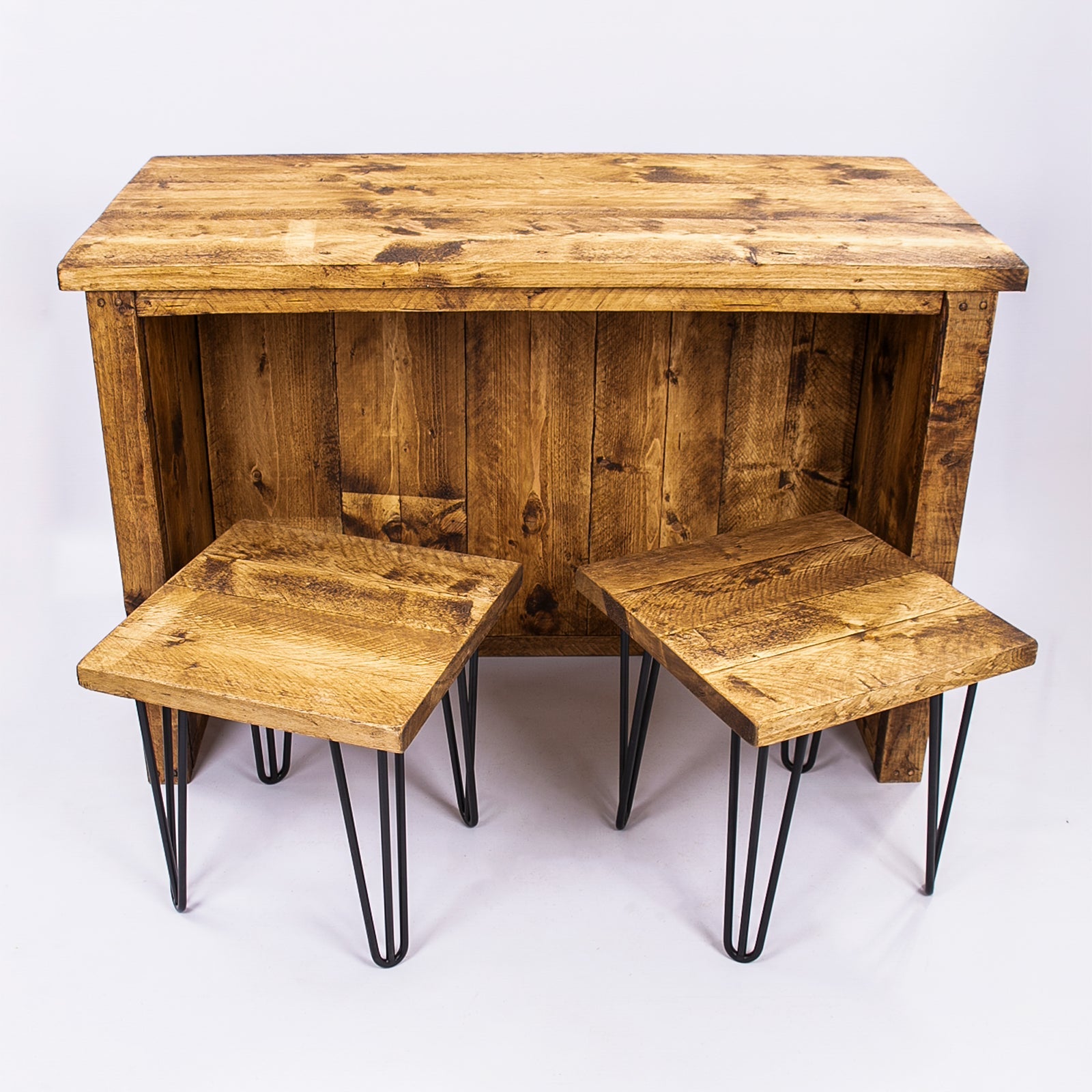 Rustic horsham breakfast bar with warm brown wooden kitchen island and two matching stools with black hairpin legs