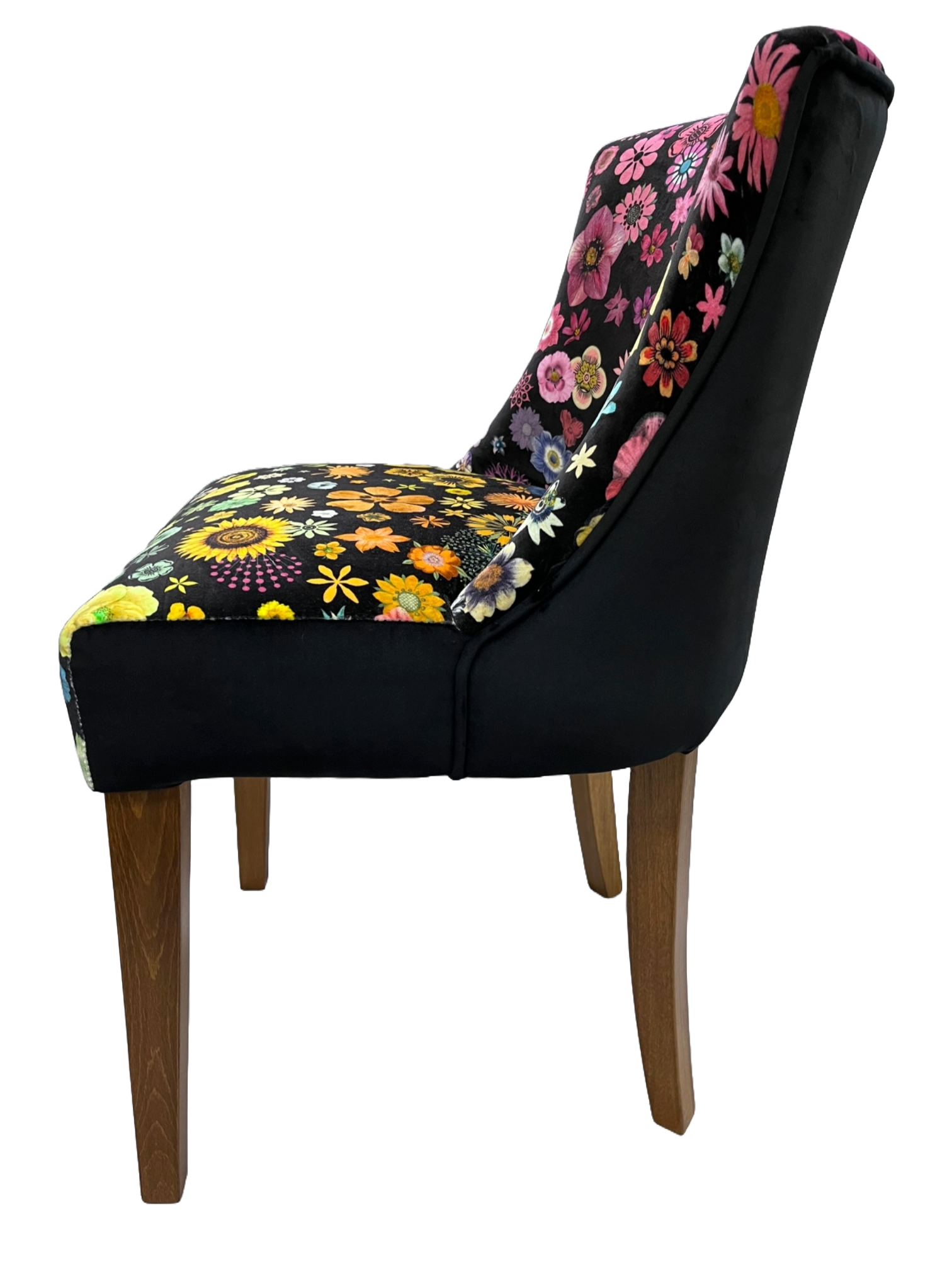 Black upholstered horton chair with vibrant pink yellow and orange floral patterns on backrest and seat