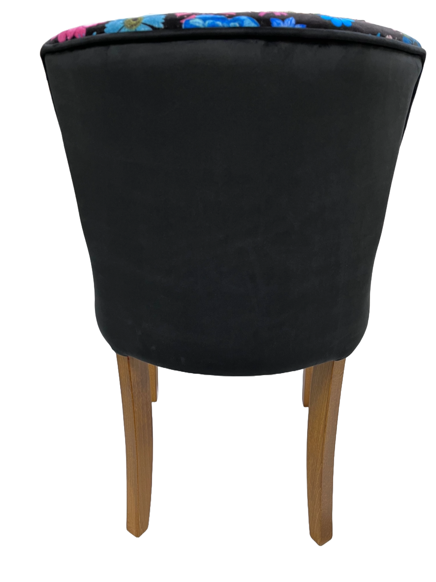Black upholstered horton chair with wooden legs and colorful floral pattern along the top edge