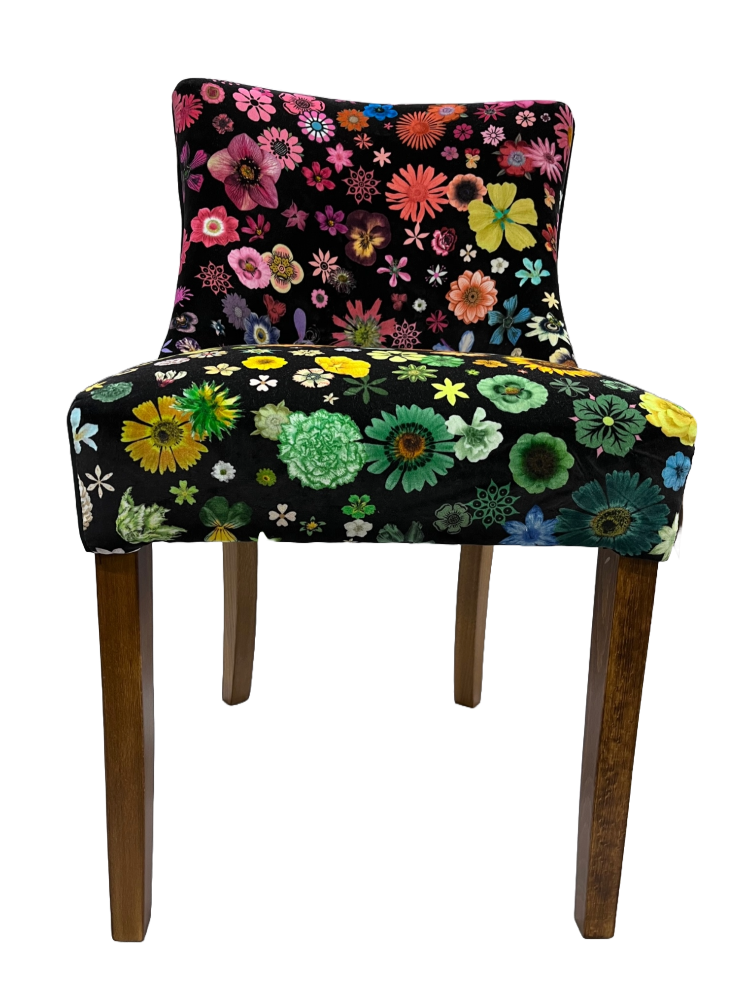 Black velvet horton chair upholstered in vibrant multicolored floral fabric with wooden legs