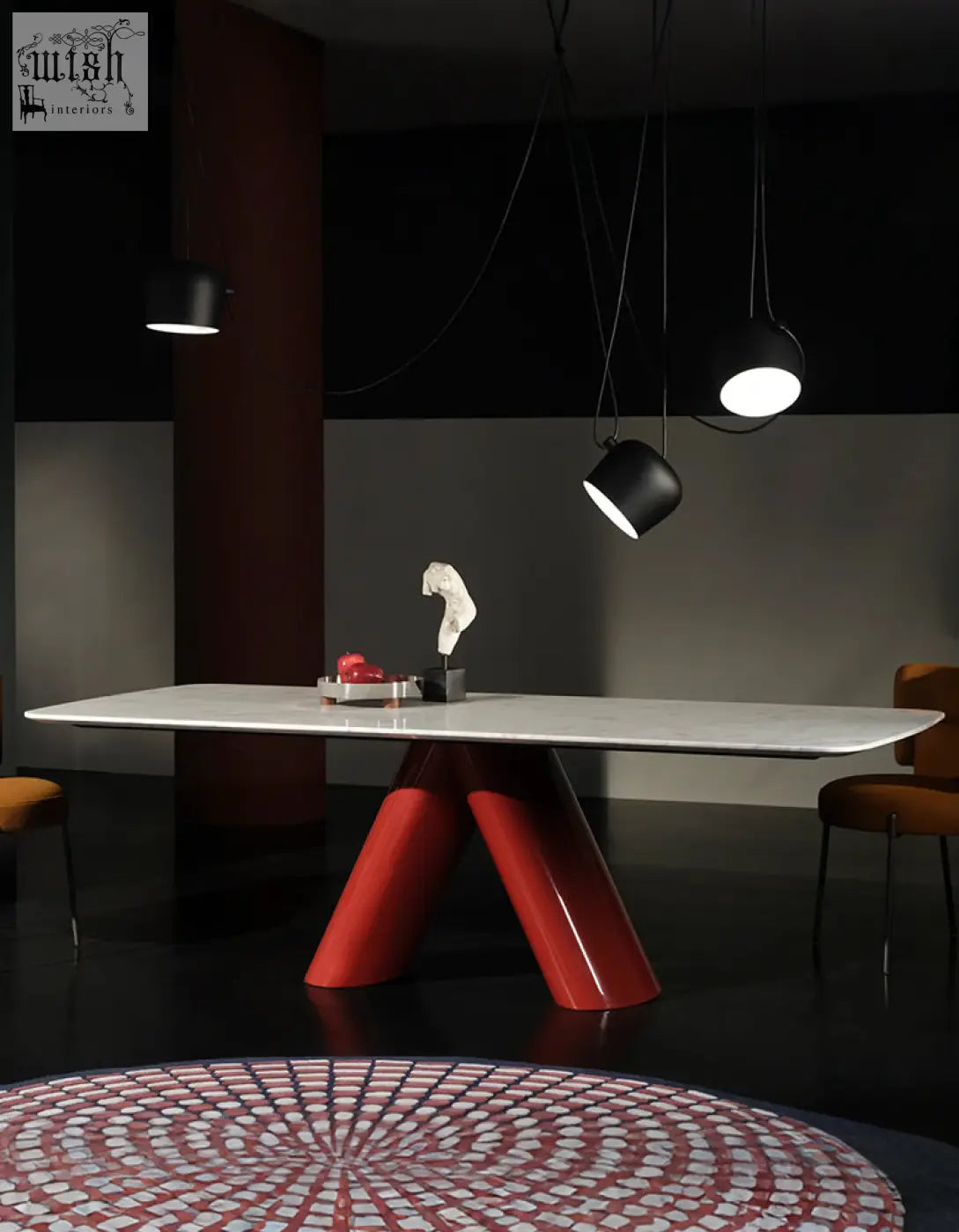 Hossain dining table with a sleek white marble top and bold glossy red v-shaped legs perfect for marble dining
