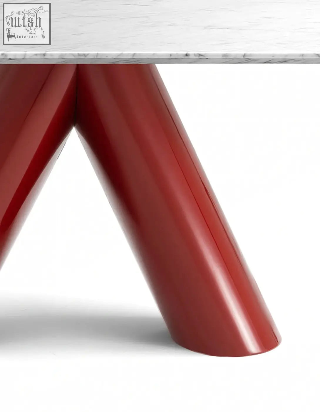 Red lacquered v-shaped legs supporting a white marble tabletop on the hossain marble dining table