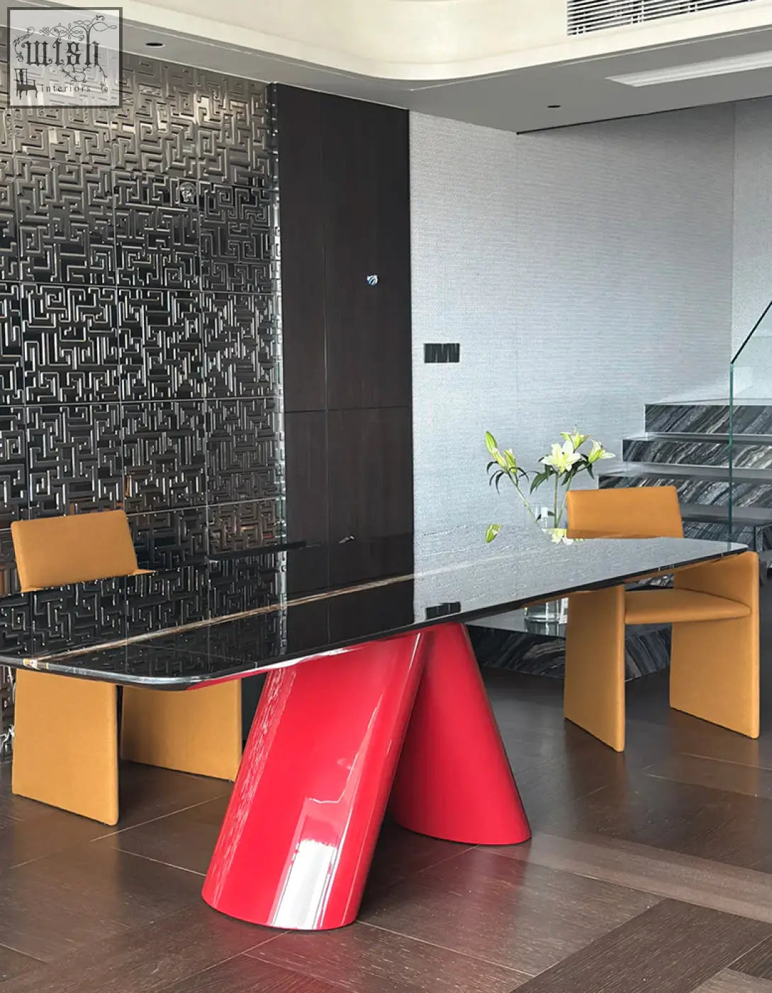 Hossain dining table with a sleek red marble base and long black glass top perfect for a modern marble dining setup