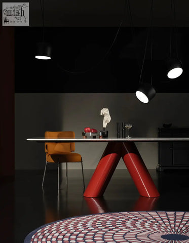 Hossain dining table with a glossy red v-shaped base and a sleek marble dining tabletop in metallic finish