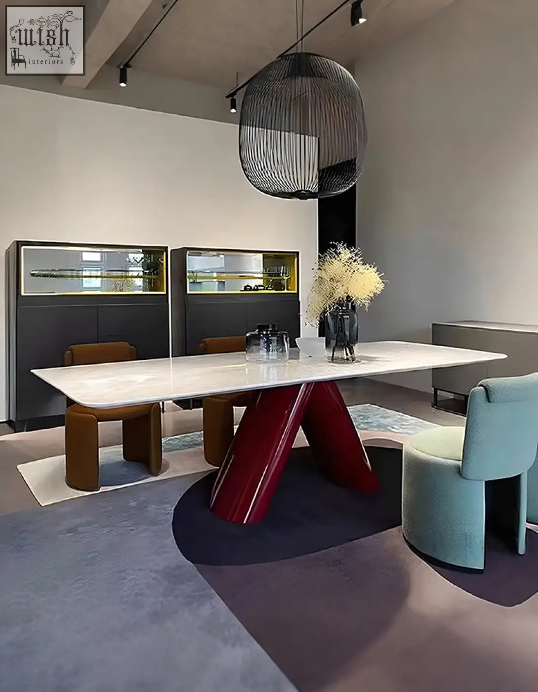 A sleek hossain dining table with a white marble top and bold glossy red v-shaped legs perfect for marble dining