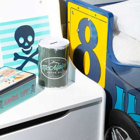 A metallic green and white mcalpine motor oil savings can money tin with a silver lid hot rod large style