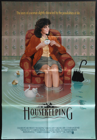 Woman in orange cardigan and gray skirt sits in red patterned armchair holding white teacup on housekeeping 1987 movie poster