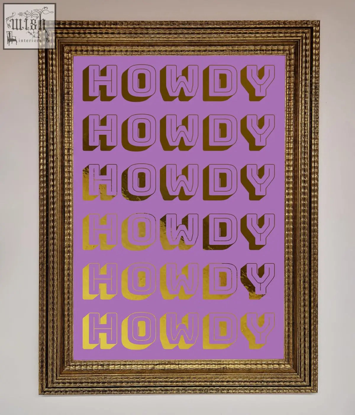 A framed howdy foil print artwork with bold purple and gold gradient lettering on a lavender background