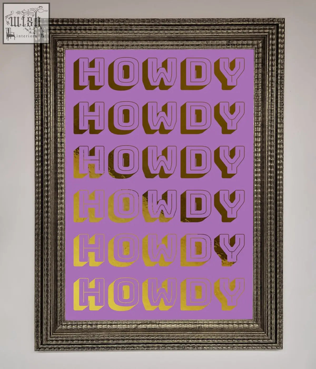 A framed howdy foil print with bold stylized lettering repeated on a lavender background with gold foil accents