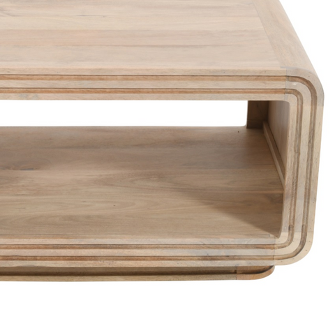 Modern light wood coffee table with sleek curved design and two tiers made of hudson carved mango wood