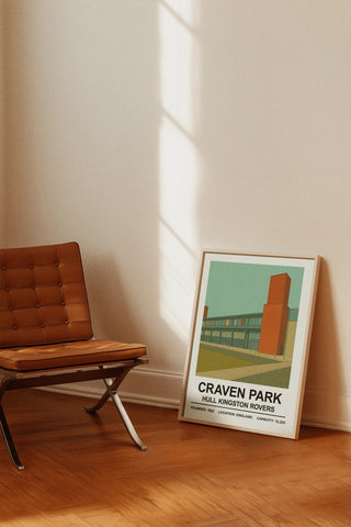A framed minimalist print of craven park stadium with bold black hull kingston rovers text on a light teal background