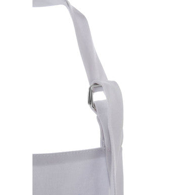 White fabric strap with silver metal buckle on hygge apron for easy adjustable fit and cozy kitchen style