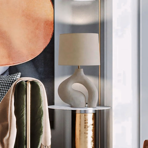 Cream-colored ceramic table lamp hyung light with sleek abstract sculptural base and matching cylindrical shade