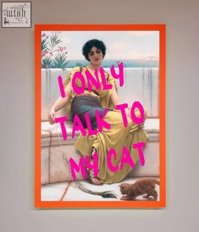 Orange-framed wall art showing a woman in a yellow gown with an orange tabby cat and bold pink i only talk to my cat text