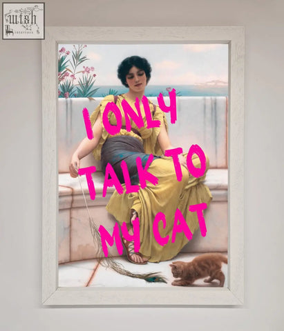 White-framed wall art featuring a woman in a yellow dress with an orange cat and bold pink text i only talk to my cat