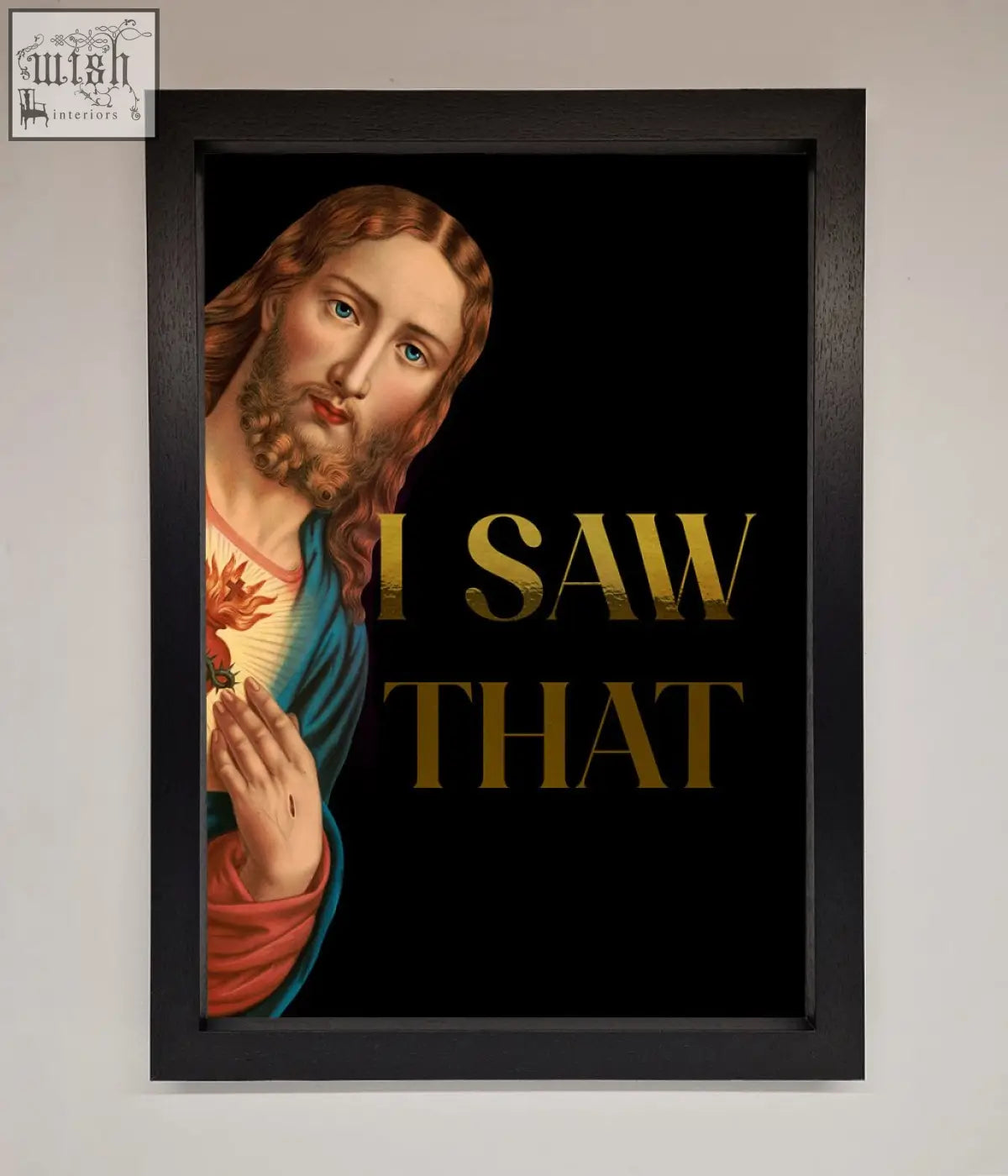 Black-framed foil print artwork of jesus with flaming heart in blue and red robes perfect for quick shipping times
