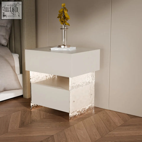 Modern white ibarra bedside table with glossy finish textured metallic-edged base and built-in light strip storage