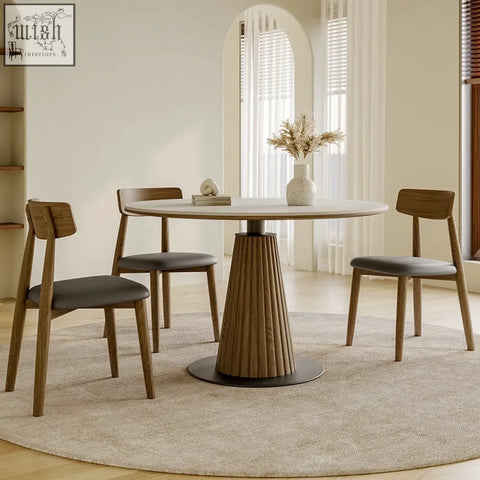 Ichiro dining table with a round tabletop featuring a light stone top and fluted wooden base for stylish dining