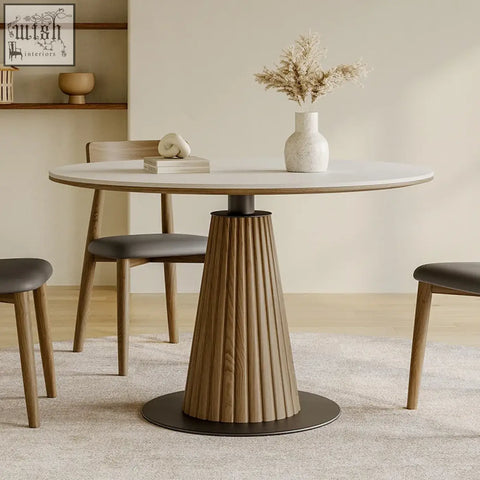Ichiro dining table with round tabletop white marble top fluted wooden base in warm oak and black metal pedestal