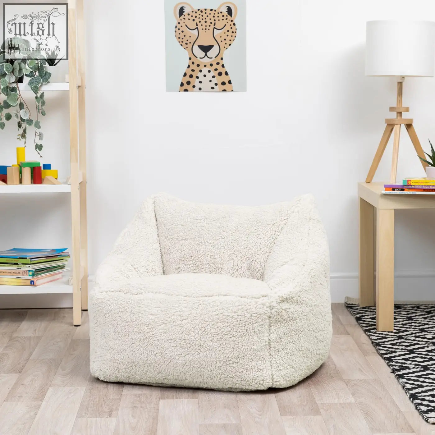 Cream kids bean bag chair made of plush teddy fleece with cozy rounded design perfect for nursery decor