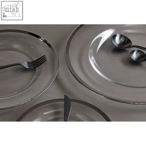 Clear glass charger plate with silver rim featuring a sleek glass design perfect for elegant table settings