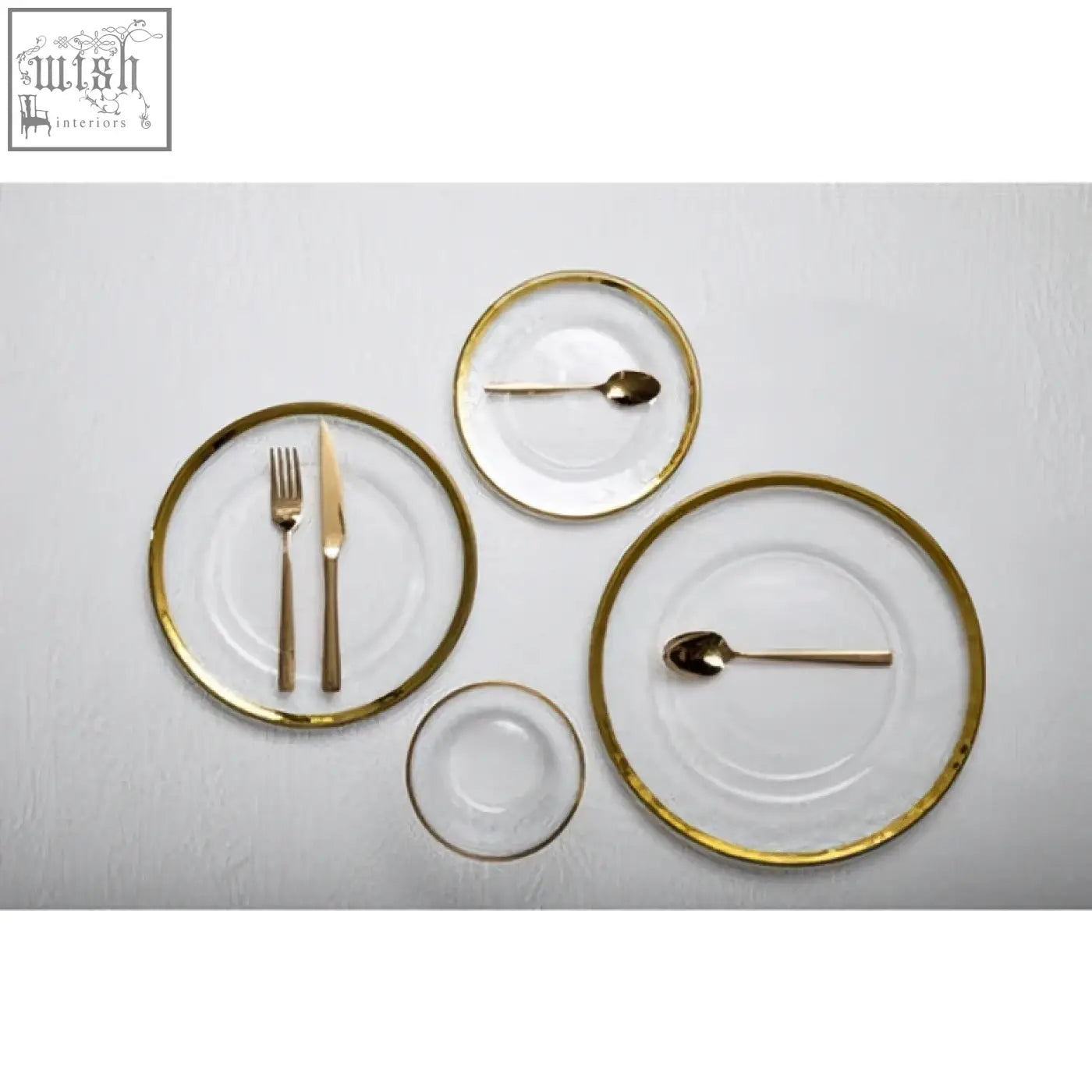 Set of ida textured glass side plates with gold rim and matching gold utensils for elegant table settings