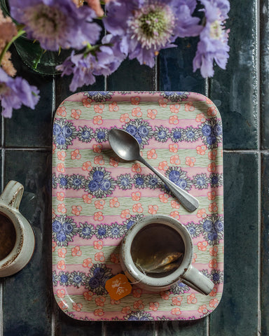 Ida wooden tray featuring a pink floral pattern with pastel stripes and blue and orange flowers on wood