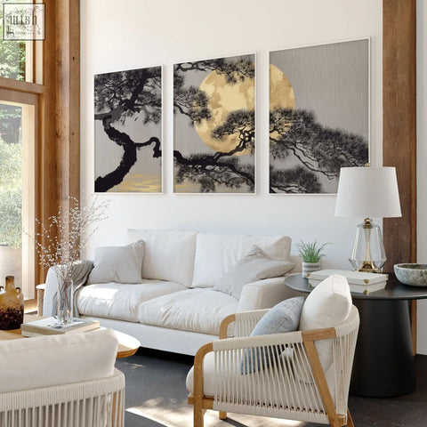Three-panel minimalist living room wall art featuring black pine branches and golden moon on gray backgrounds framed white