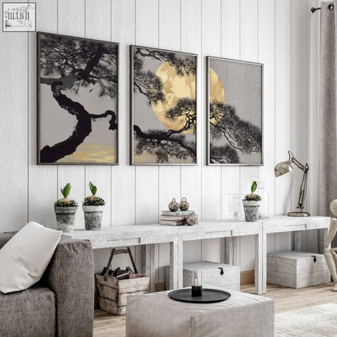 Three framed pine tree wall art with black silhouettes on gray and gold backgrounds for living room wall decor