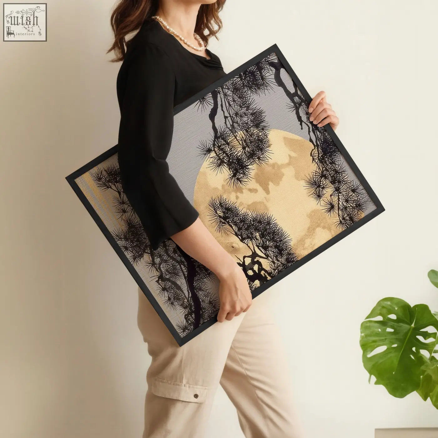 Black-framed living room wall art set featuring gold-toned moon and black japanese pine on textured gray background