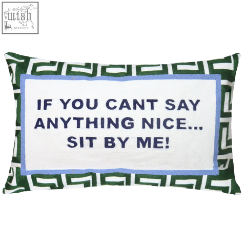 Green velvet needlepoint cushion with geometric pattern and navy embroidered if you cant say anything nice text