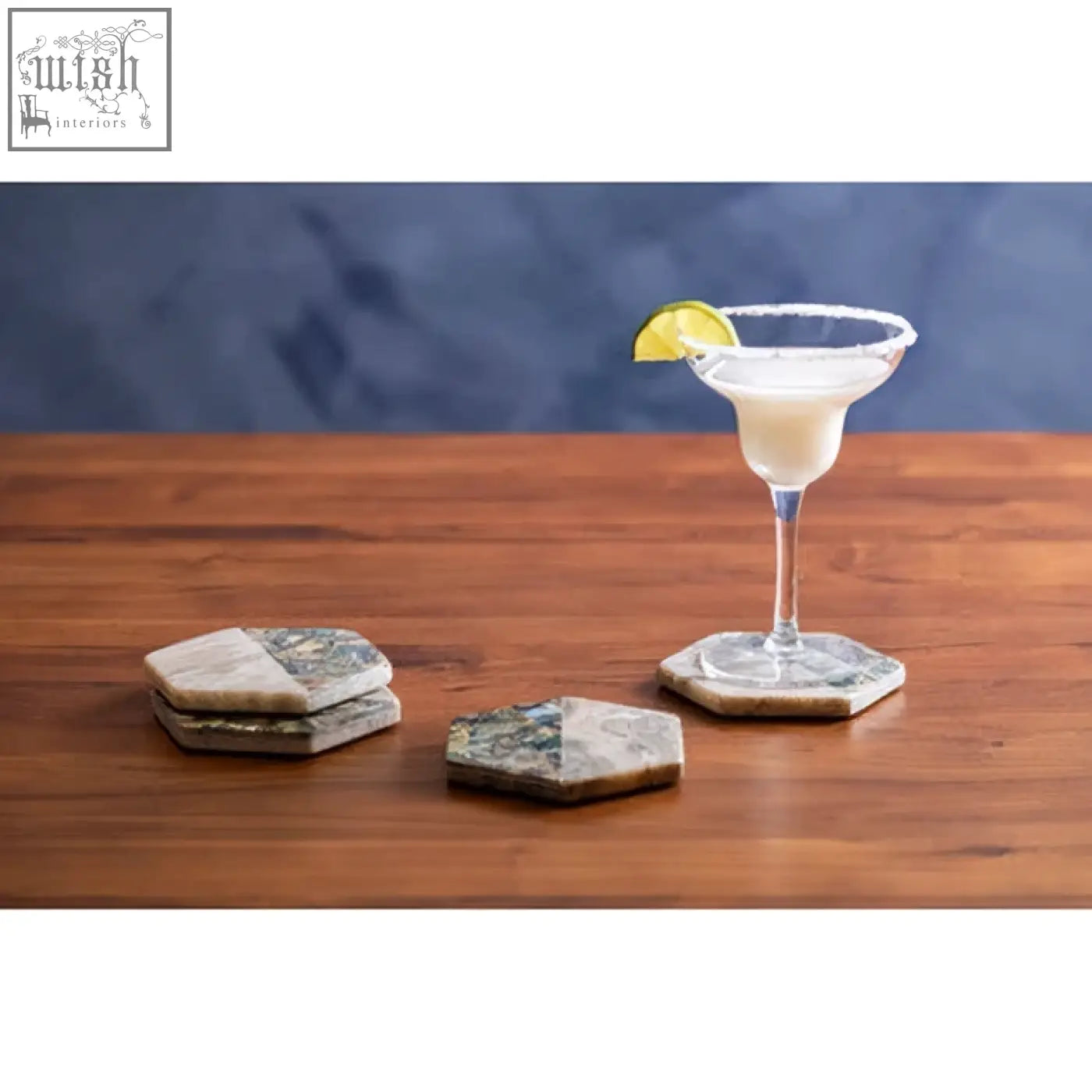 Hexagonal four beige marble and paua shell coasters with natural earthy gray and beige tones for stylish tabletops