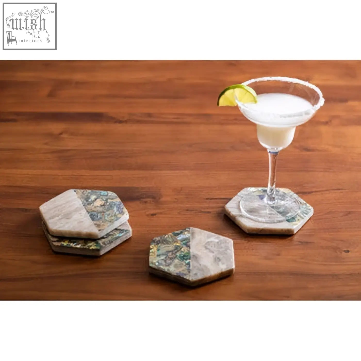 Hexagonal four beige marble coasters with paua shell inlays and natural gray green veined pattern from imogen set