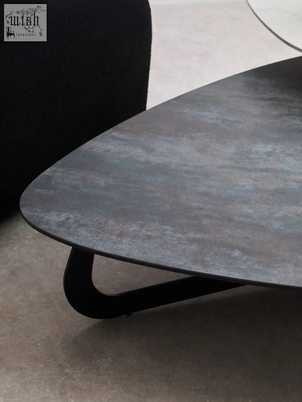 Imperia 2 tier large asymmetrical ceramic coffee table with dark gray textured stone surface and black metal legs