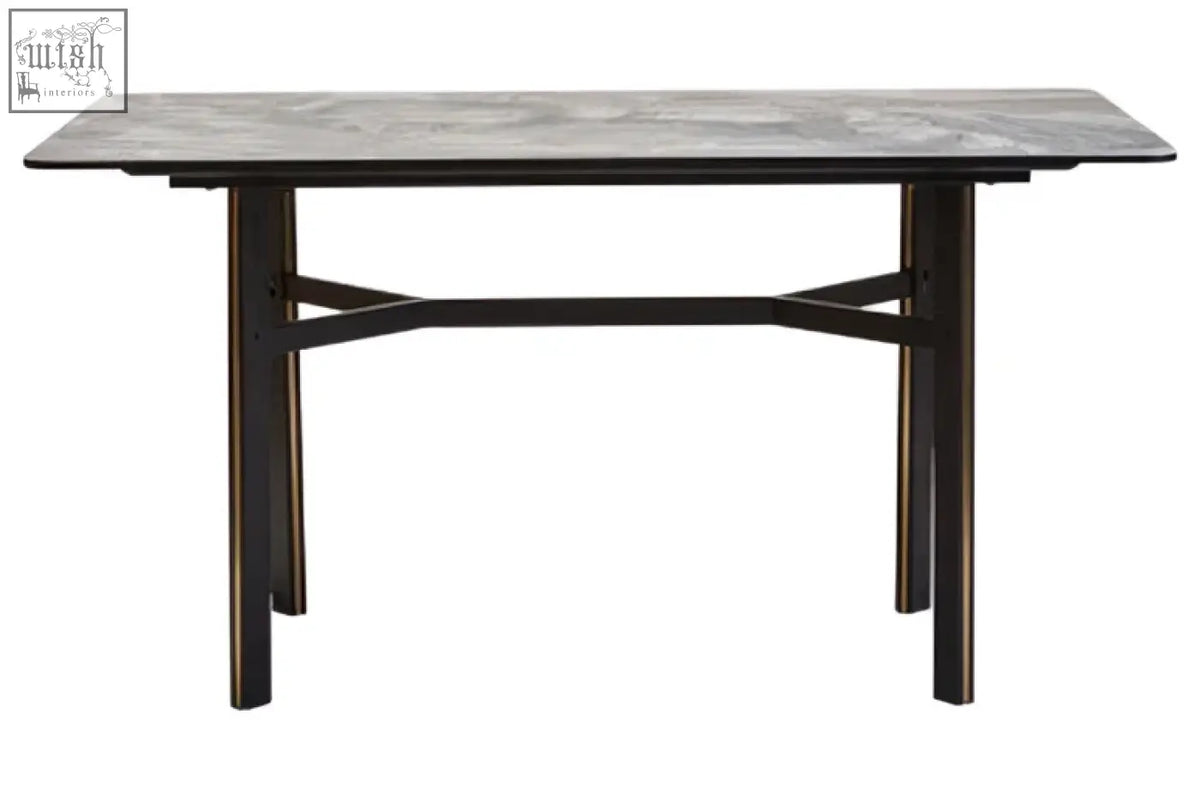 Dark gray rectangular dining table with ceramic marble effect top and black metal x-shaped support legs