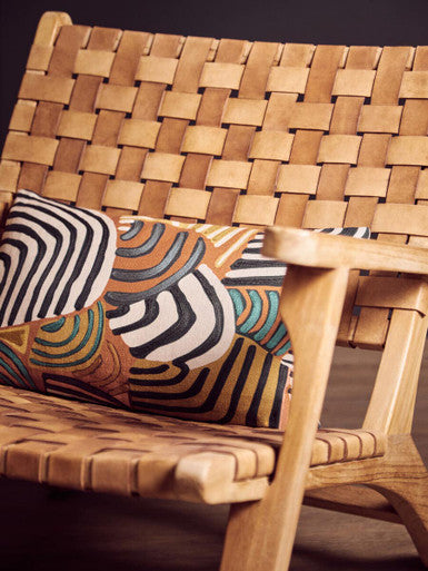 Woven wooden rocking inca armchair with leather straps and striped cushion on american oak frame