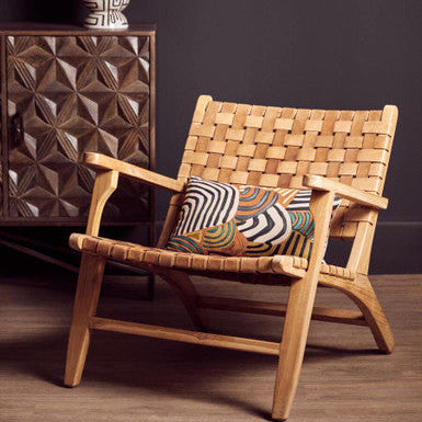 Inca armchair with woven natural wood, leather straps, american oak frame, and geometric-patterned cushion in brown tone