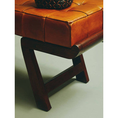 Tan leather tufted bench with dark wooden base and angular legs ideal seating solution for living spaces