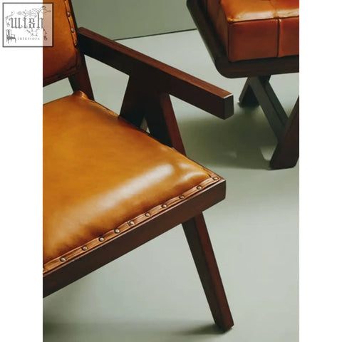Inca tan leather and teak frame dining chair with tan leather seat dark wood frame and brass nailhead trim