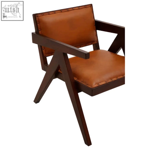 Inca tan leather and teak frame dining chair with tan leather seat and x-shaped dark wood frame legs