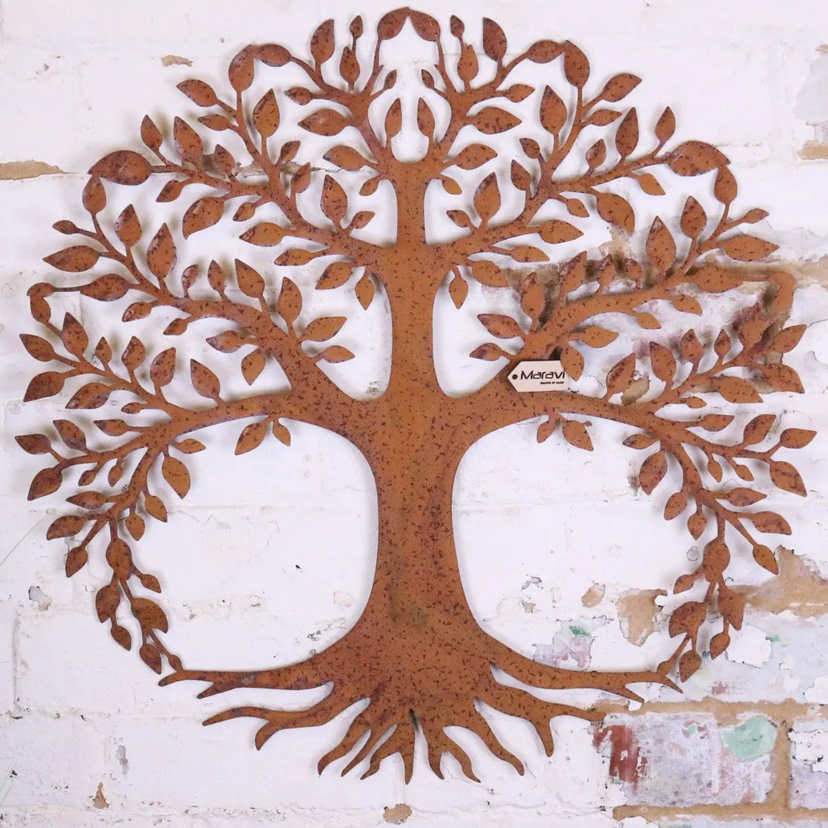 Rust-colored metal garden wall art with intricate leaf and root details in the indari tree design 60cm tall