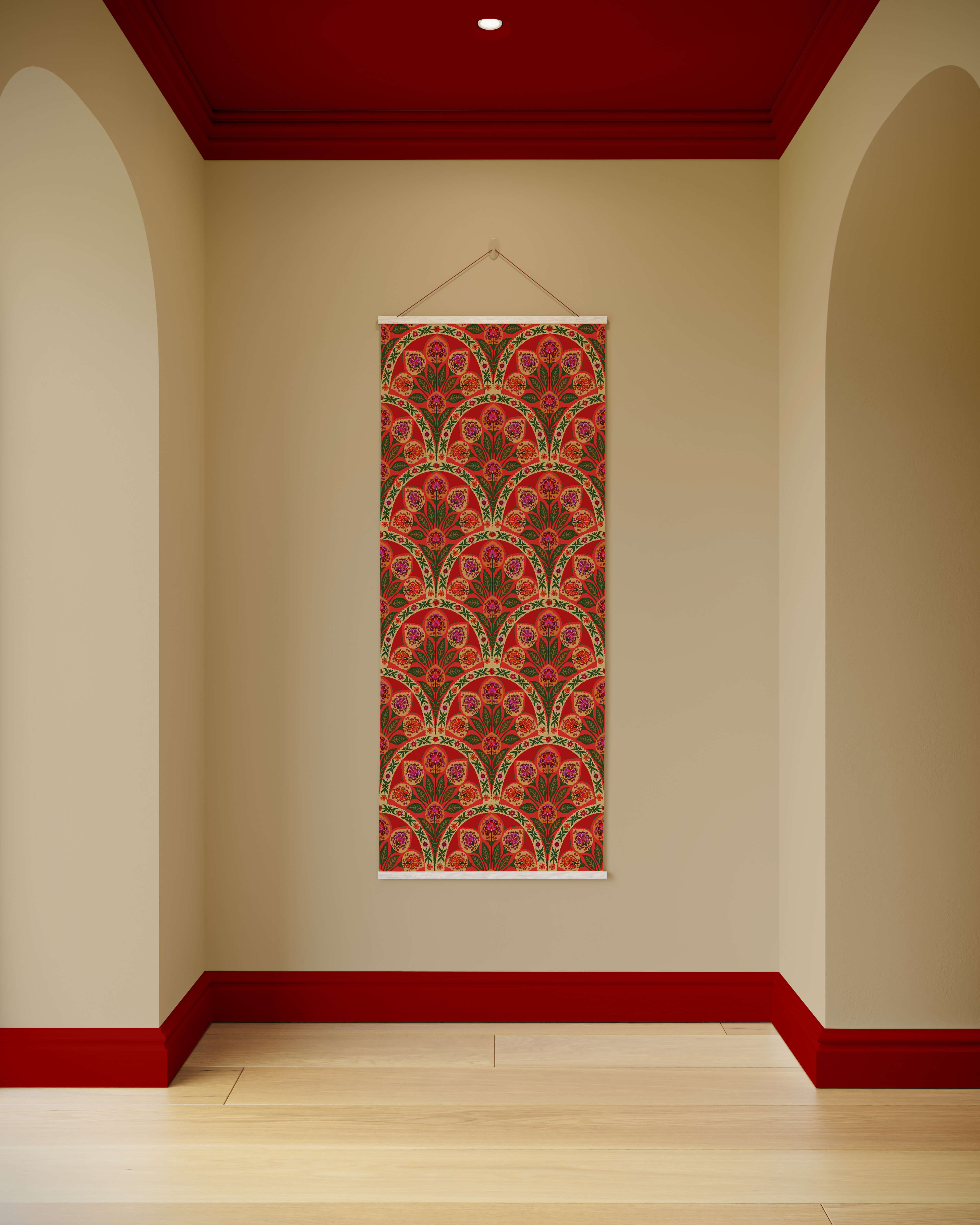 A vibrant red and green indian floral tapestry with a repeating fan pattern and white borders for wall decor