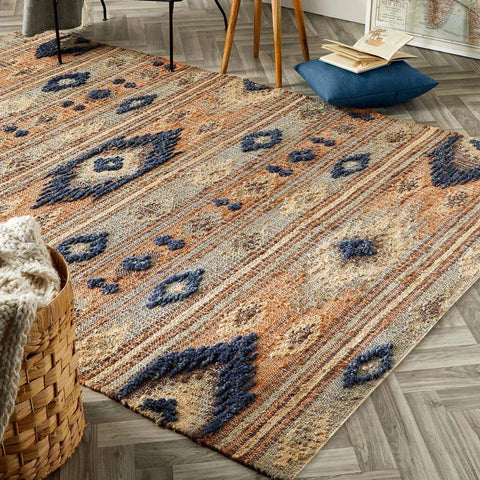 A textured indio multicolour aztec jute rug with orange beige and navy geometric woven pattern