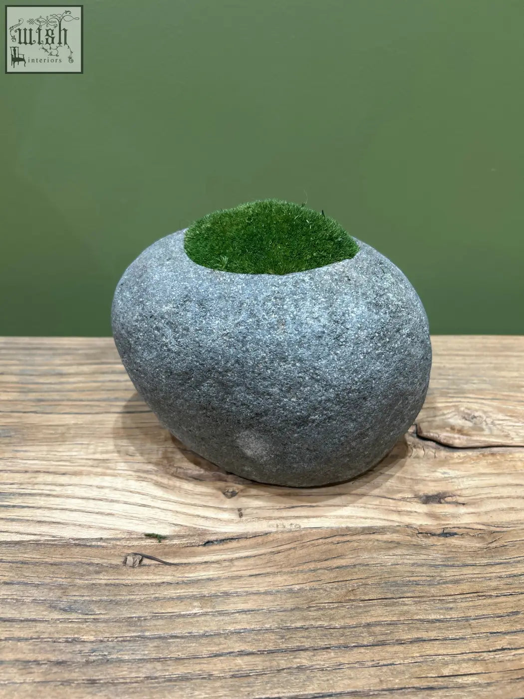 A smooth gray indo riverstone planter with natural texture filled with vibrant preserved moss fr68 greenery