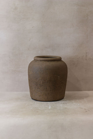 Earthenware ceramic jar indonesia pot no 17 with rounded body flared rim and textured muted brown surface