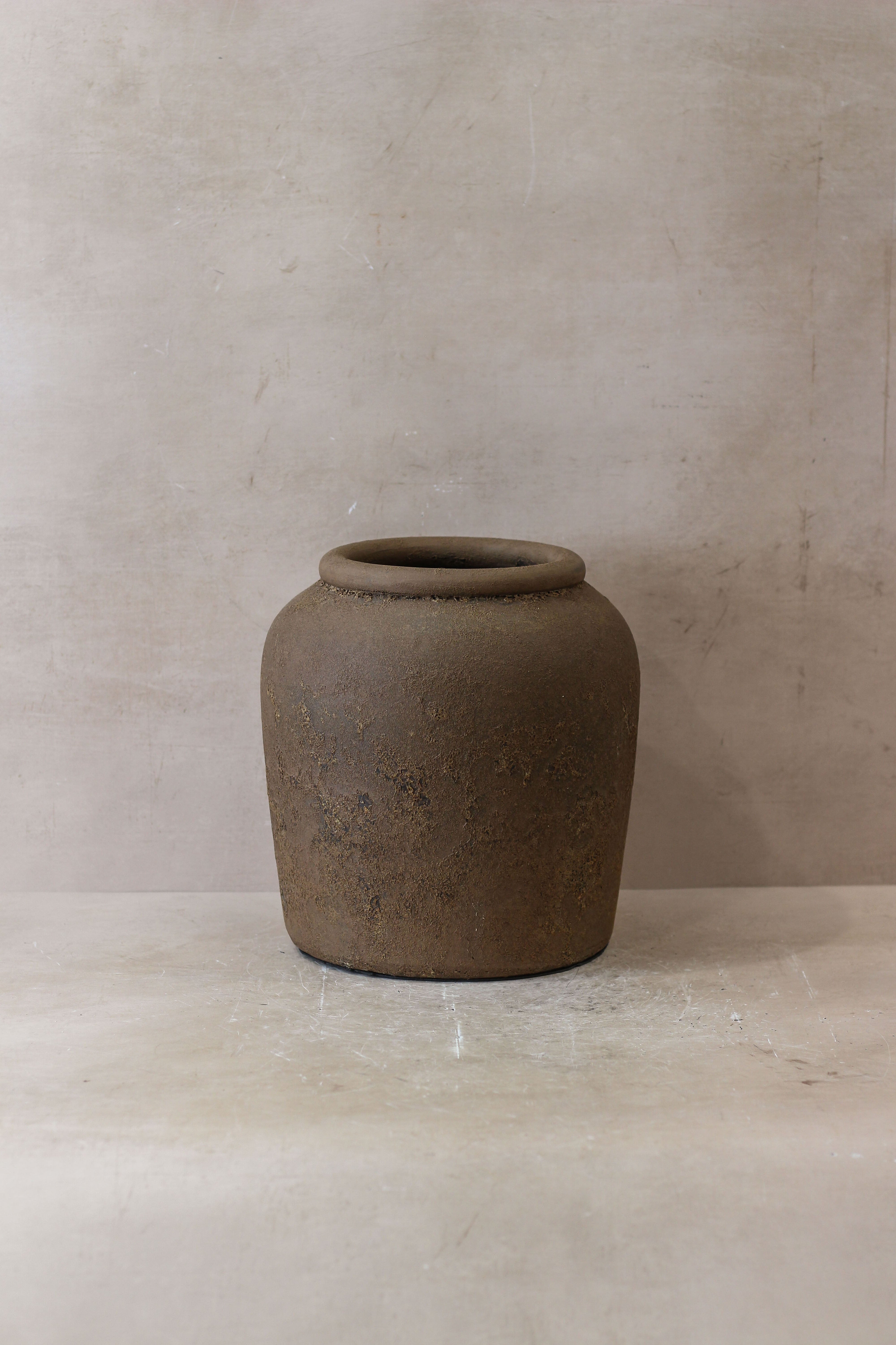 Earthenware jar indonesia pot no 17 with matte textured surface and earthy brown color