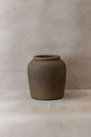 Earthenware indonesia pot no 17 with rounded body flared rim and textured surface in muted brown tones