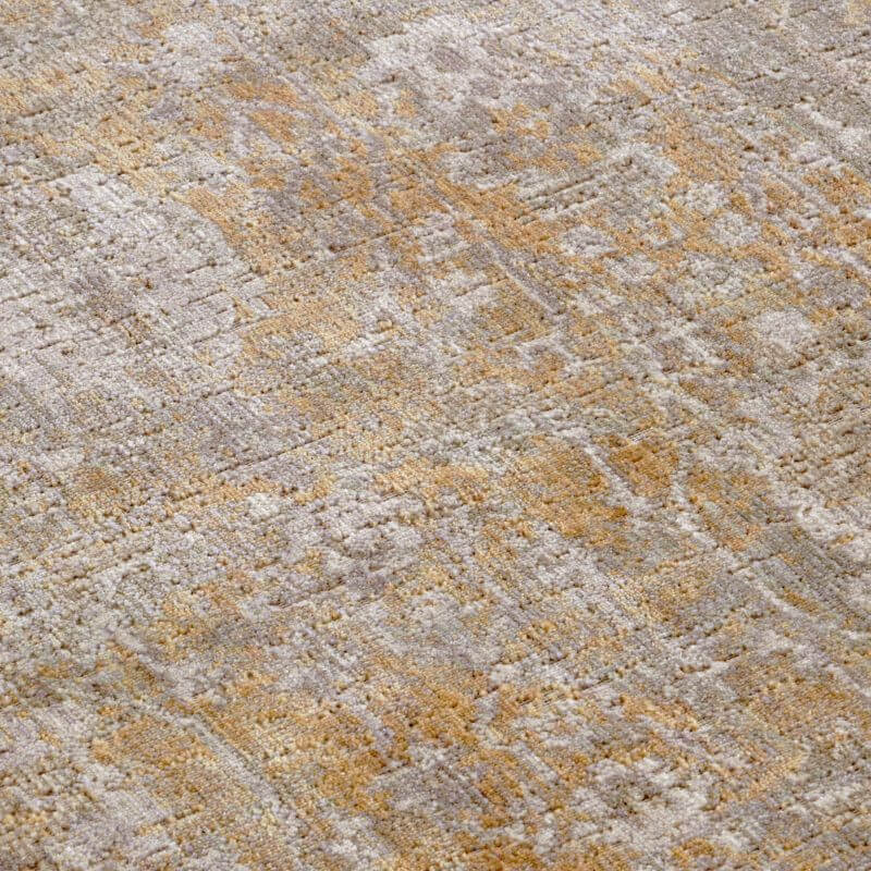 Textured indoor outdoor alexandria rug with faded vintage floral border pattern in muted beige and gold tones