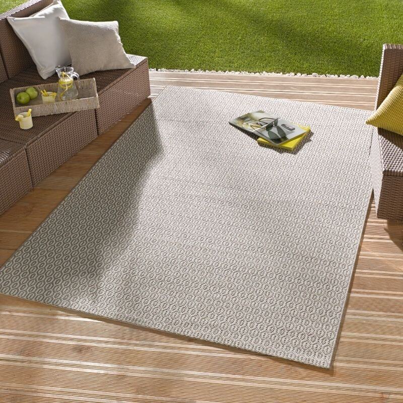 Beige indoor outdoor coin rug with subtle geometric pattern perfect for indoor outdoor use