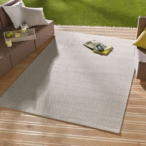 Beige indoor outdoor coin rug with subtle geometric pattern perfect for indoor outdoor use